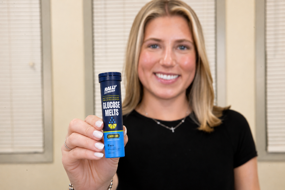 Amanda Simeone, founder of Rally, holding a tube of Rally Higher Glucose Melts